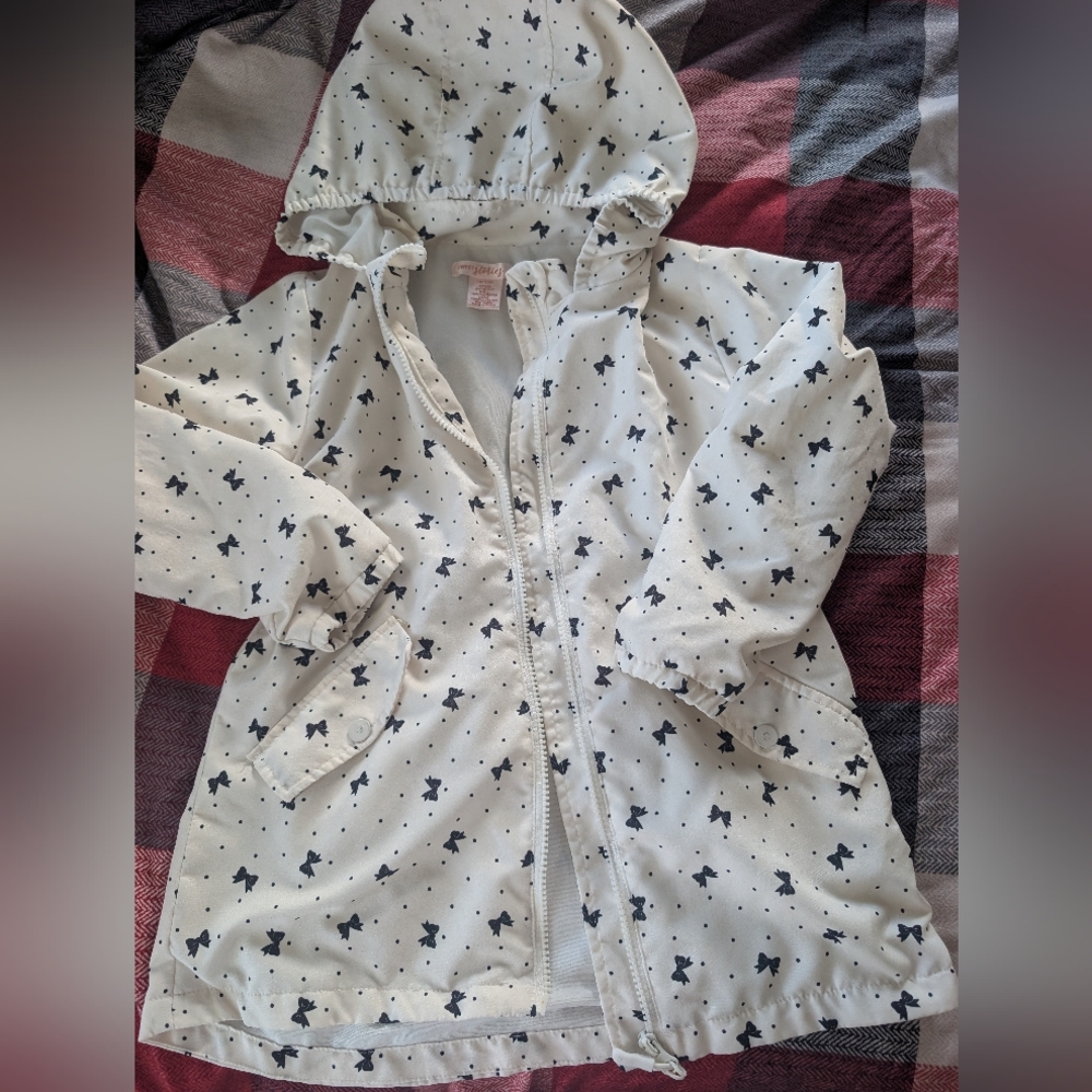 White Hooded Raincoat with Black Bow Pattern